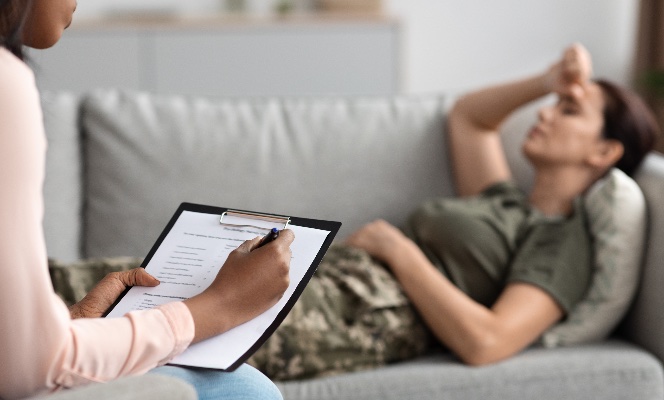 Women laying on couch talking to a therapist
