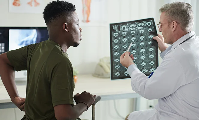 a man looking at an x-ray