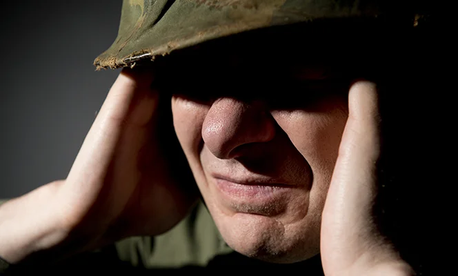 a man wearing a military hat