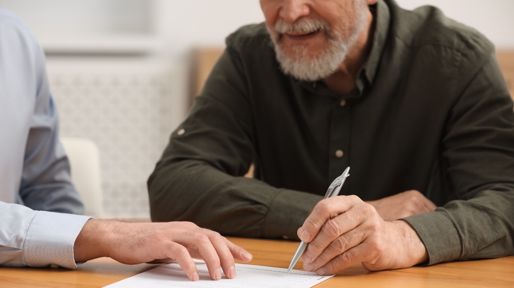 lawyer shows veteran where to sigh document