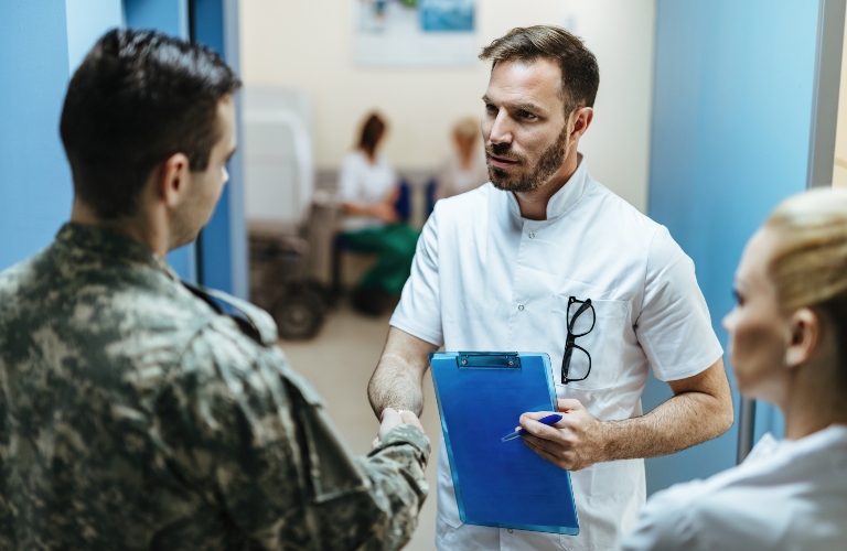 Doctor and military man shaking hands