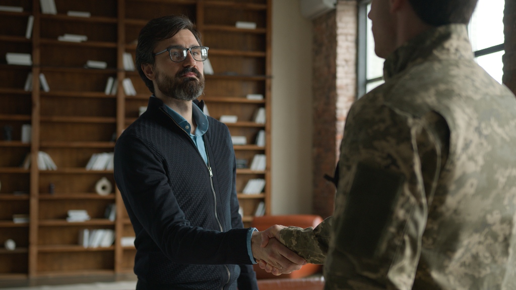 veteran shakes hands with his lawyer