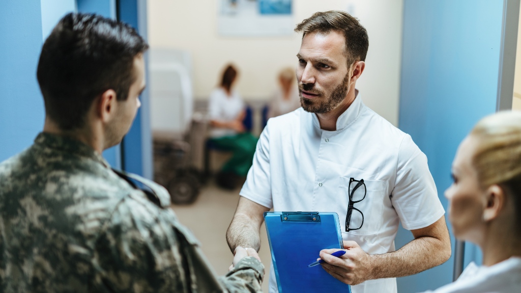 Doctor and military man shaking hands