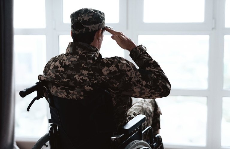 Disabled veteran is looking out the window
