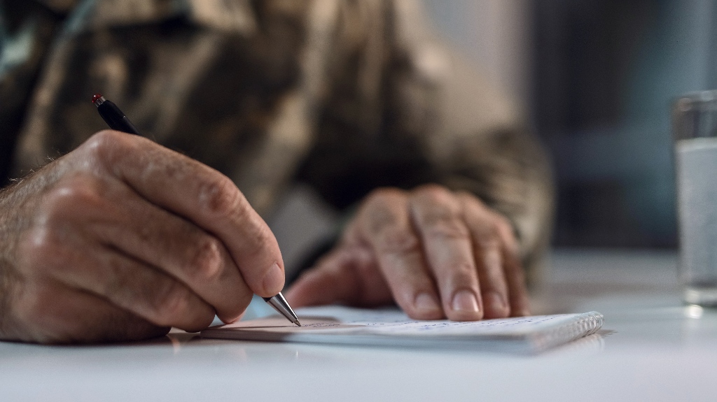 veteran is writing a letter