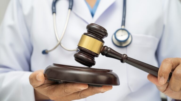 Doctor is holding judge's gavel