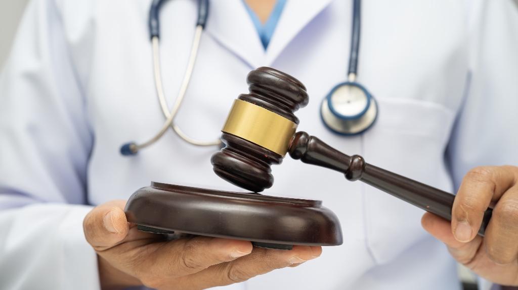 Doctor is holding judge's gavel