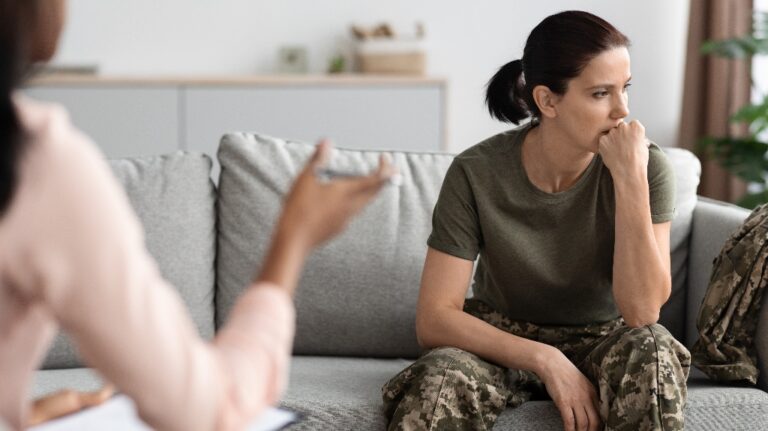 Female veteran attending meeting with psychologist