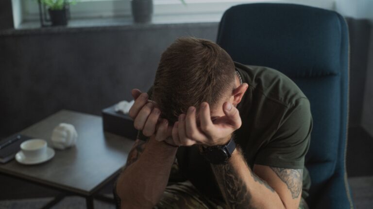 veteran covered his face with his hands