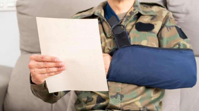 Reading letter about Injury and soldier compensation paperwork