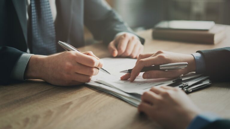 Lawyer is showing where to sign documents
