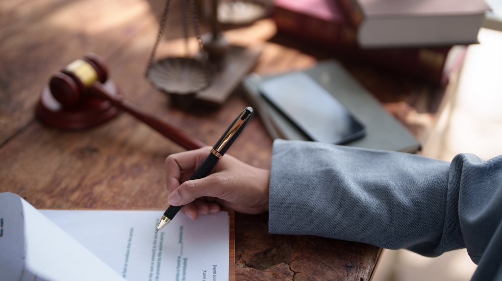 Lawyer is signing documents